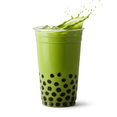 matcha latte with boba pearls is shown in a clear plastic cup, with green liquid splashing out from the top, against a white background.