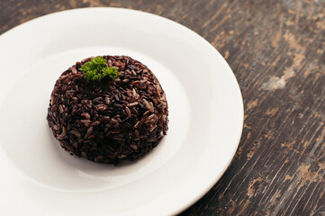 Dark Purple Rice Dish on Rustic Wooden Table