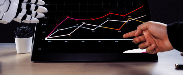 AI-powered assistance enhancing workplace productivity as a consultant works on business plans and marketing data, emphasizing the role of artificial intelligence. Noogenesis AI