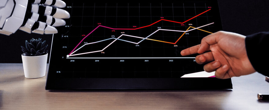 AI-powered assistance enhancing workplace productivity as a consultant works on business plans and marketing data, emphasizing the role of artificial intelligence. Noogenesis AI