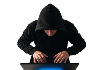 Hacker in a hoodie typing on a laptop
