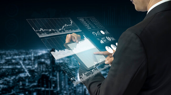 A businessman interacts with a digital interface displaying various data visualizations and graphs, showcasing modern financial analysis technology. Impute