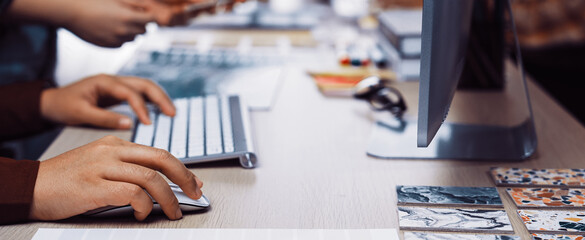 A dynamic scene showcasing diverse hands engaged in design work at a modern workspace, highlighting collaboration with digital tools, colorful swatches, and creative inspiration. SACTR
