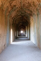 Fototapeta premium Perspective of the famous vaulted tunnel at the Sanctuary of Jupiter Anxur, a Roman temple in Terracina, Italy