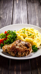 Grilled Pork with Mash, and Salad.
