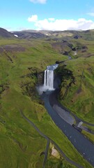 Aerial view of a waterfall cascading down a valley