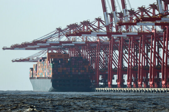 Gantry cranes beside cargo ship at Yangshan Port Shanghai