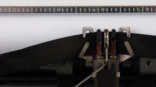 The phrase EU TARIFFS is typing on a retro typewriter.