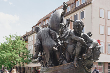 The Narrenschiffbrunnen represents fools on a ship, and the sculpture  is located close to the main market of Nuremberg