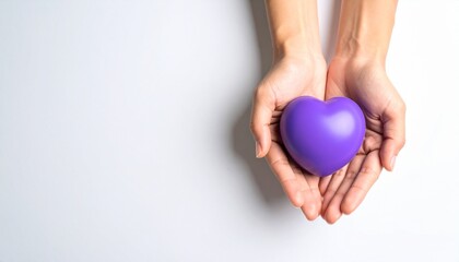 Person holding a purple heart-shaped object in cupped hands, symbolizing care and love.