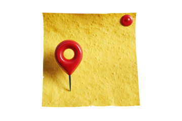 A red map pin on a textured yellow surface