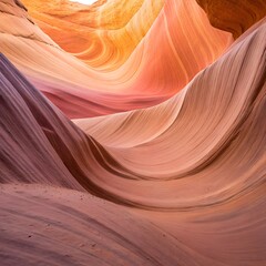 Swirling sandstone formations in a slot canyon bathed in warm ethereal light creating a natural abstract art pattern