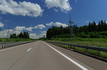 the road on a summer day. Highways, roadside and road line markings.