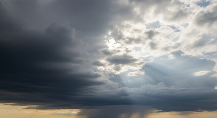 Obraz premium Dramatic Sky with Sunbeams Breaking Through Storm Clouds Weather Landscape Photography for Nature Backgrounds and Atmospheric Art