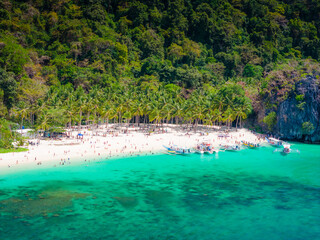 Seven commandos beach in El Nido, Palawan, Philippines islands. Aerial drone view. Top view of beautiful turquoise beach, with white sand and palms