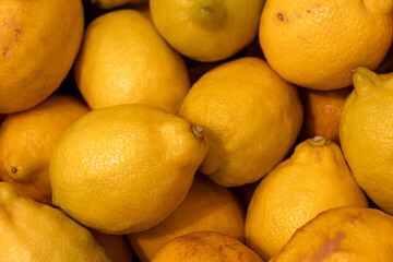 Full yellow lemon fruit bunch as background