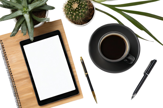 Flat lay of workspace with tablet, plants, coffee