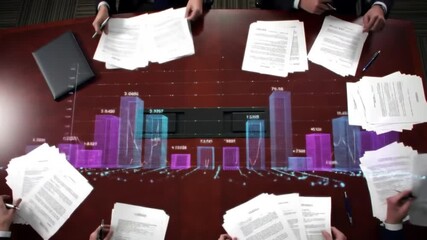Business meeting with data visualization on a conference table, showcasing financial trends and analysis - Powered by Adobe
