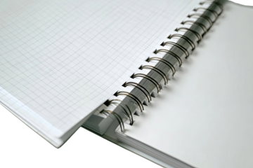 Open spiral-bound notebook, grid paper