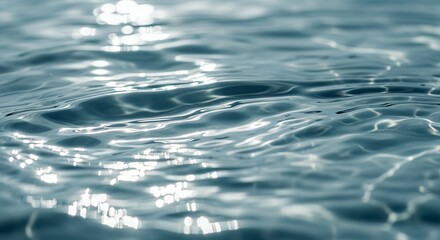 Rippling Water Surface Close Up with Sun Glare Reflections Abstract Blue Tone Tranquil Nature Stock Photo