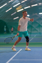 Man playing tennis on a court