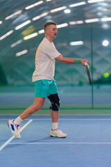 Man playing tennis on a court
