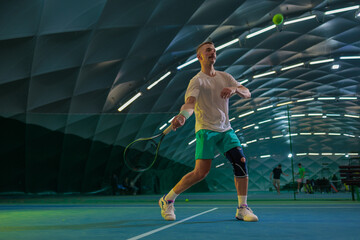 Man playing tennis on a court