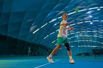 Man playing tennis on a court