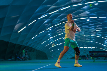 Man playing tennis on a court