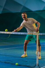 Man playing tennis on a court
