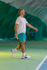 Man playing tennis on a court