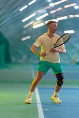 Man playing tennis on a court
