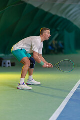 Man playing tennis on a court