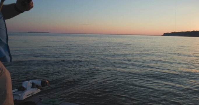 Man Fighting a Big Fish During Sunrise On Lake Livingston TX