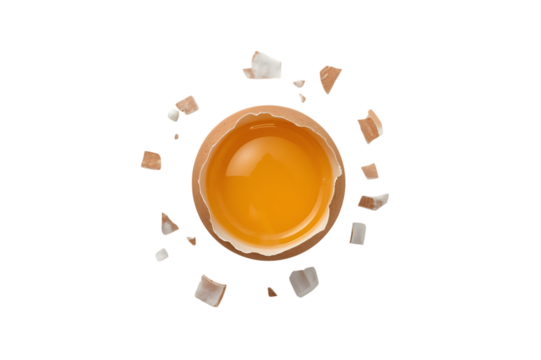 Broken Egg Reveal: A close-up shot unveils a broken egg, revealing its golden yolk amidst scattered shell fragments, offering a symbolic representation of freshness and culinary potential.