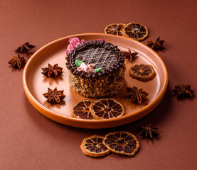 Sweet tart, pie with chocolate and cream with fruit filling on a plate. Chocolate tart