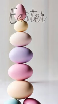 Stacking easter eggs: vibrant pastel balance in vertical composition for festive decor