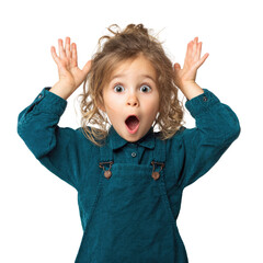 A surprised little girl with blonde curly hair, wearing a teal overall dress, makes a funny face with her hands up. background removed