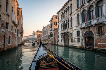 Obraz premium Gondola ride through historic venetian canal at sunset