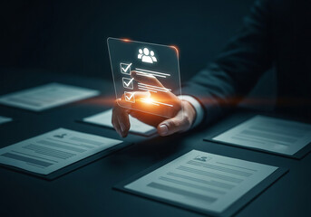 Photo of a person is holding a digital application form, surrounded by printed resumes, representing the job recruitment process