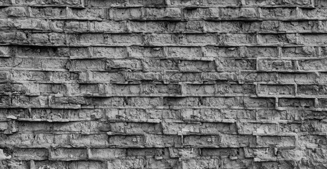 A brick wall damaged by time