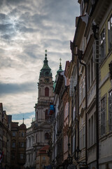 Obraz premium church of our lady before tyn, Baroque-style Church of St. Nicholas dominates the view. The church is prominent with its striking green dome and bell tower, which rises above the surrounding rooftops