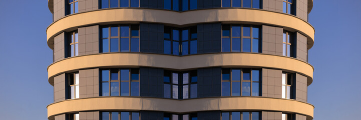 Cityscape on a summer day, modern buildings and houses 