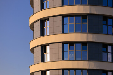 City view, modern buildings against the blue sky.