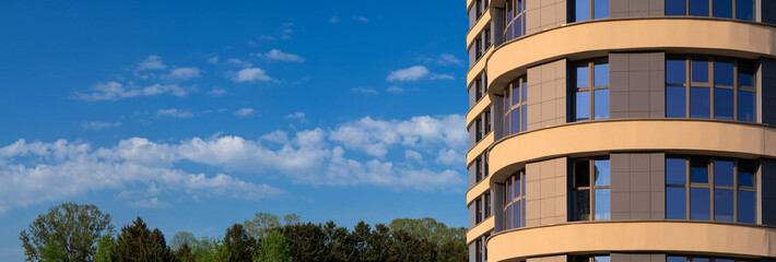 City view, modern buildings against the blue sky.