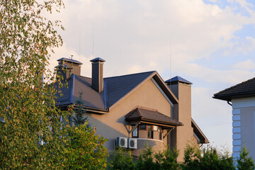 City view, modern buildings and skyscrapers against the blue sky.