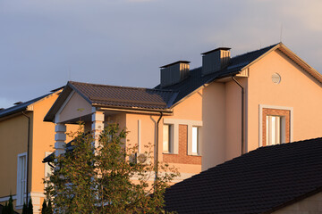 Cityscape on a summer day, modern buildings and houses 