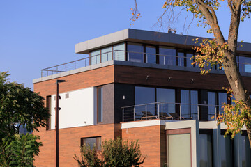 Cityscape on a summer day, modern buildings and houses 
