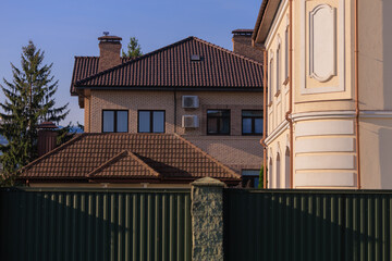 Cityscape on a summer day, modern buildings and houses 