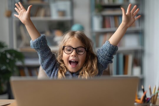 A young student with glasses joyfully raises their hand during a virtual classroom session. Their clean desk is filled with school supplies, showcasing enthusiasm for learning - Powered by Adobe